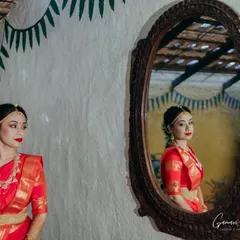 A creative mirror portrait from a bridal shoot. I always make sure the makeup is flawless from every angle, as seen here with her elegant side profile and the classic red lip.