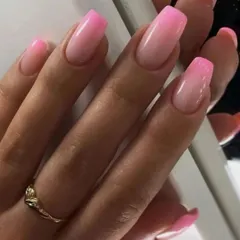 A vibrant pink ombre on coffin-shaped nails, showing a smooth transition from a light base to a bright, saturated pink.