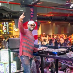 A great shot of me interacting with the Holi crowd from the DJ console. I'm always on the mic, making sure the energy stays high and everyone feels like part of the show.