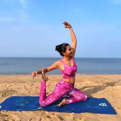 Embracing the playful energy of the ocean with a variation of Eka Pada Rajakapotasana, or mermaid pose. Practicing on the sand challenges my balance and reminds me to flow with life's currents. My beach yoga sessions are designed to help you find joy and release, connecting with the rhythm of the waves.