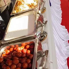 A close-up of our dessert selection, including classic Indian sweets like Gulab Jamun, a perfect end to a housewarming feast.