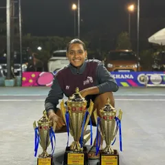 Simran Bundela showcasing her three trophies from a state tournament in Goa. This incredible achievement is a testament to her hard work and the effectiveness of our training program.