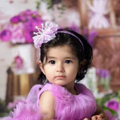A little princess in her purple tutu. Sitter sessions are great for showing off cute outfits, as the baby can sit up and show them off.
