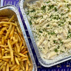 A classic kid-approved combo: creamy white sauce pasta and crispy french fries. I offer bulk trays of popular dishes for parties and events.