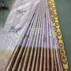 A wider view of the perfectly set pleats on a beautiful lavender saree during a workshop demonstration.