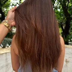 A shot of Amyra Dastur's hair from the back, showing off the subtle balayage highlights and the healthy shine.