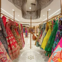 A vibrant display of lehengas at the Nalli flagship store. For this retail project, we designed custom circular racks to create a dynamic and immersive shopping experience, using color and form to tell the brand's story.