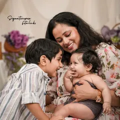 A family is a story of love. We focus on capturing those unscripted, joyful interactions, like this moment between a mother, her son, and their newest family member, creating memories that feel as warm as the hug itself.