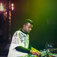 Locked in and focused on the mix. This is me in my element, reading the crowd and lining up the next track to keep the energy high at a packed festival event.