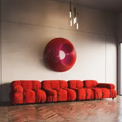 Make a bold statement with our Radiant Circles abstract wall sculpture. The vibrant red and hypnotic, wavy form create a powerful centerpiece, perfect for adding a dramatic and modern flair above a sofa or in an entryway.