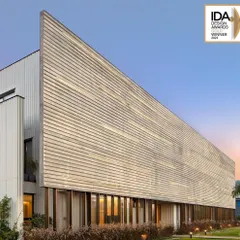 The facade of the award-winning Laxcon Steel Plant Office showcases a textured, brutalist-inspired concrete form. This project is a testament to our philosophy of creating powerful architectural statements for industrial clients that are both functional and visually compelling.