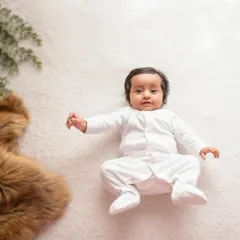 For the love of whites. This simple overhead shot of a baby in a white onesie on a white rug is a classic for a reason. It's clean, sweet, and absolutely timeless.