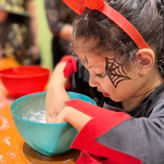 Getting her hands messy while making a bath bomb. These sensory activities are fantastic for kids, allowing them to create something they can take home.