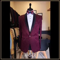This maroon tuxedo jacket features a unique geometric pattern woven into the fabric. Paired with a black shawl lapel and a patterned bow tie, it's a statement piece for any celebration.