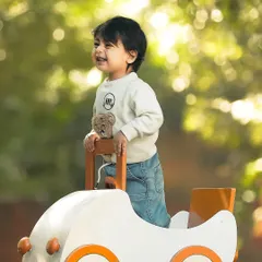 The pure, unfiltered joy of childhood. This outdoor lifestyle session captures a little adventurer's happy smile, bathed in beautiful natural sunlight. These candid shots are all about letting kids be kids and preserving their genuine spirit.