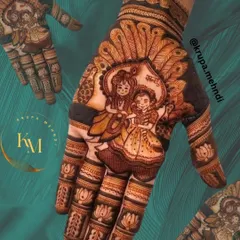 A sweet and charming portrait of Radha and Krishna, framed by peacock feathers. This style of portraiture is perfect for brides who want to incorporate a story of love and devotion into their wedding henna.