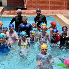 A snapshot of the energy and fun from one of our regular swimming classes. You can see our coaches right in the water with the kids, making a splash and learning together.