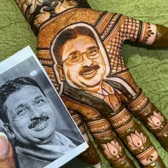 This design is one of my favorites and holds a special place in my heart. The bride wanted a portrait of her father on her palm with the words 'Papa meri jaan', and creating this emotional piece was an honor.