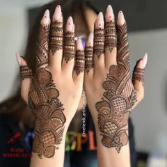 A striking back-hand design with bold, flowing patterns and intricate net-work, perfect for making a modern statement.