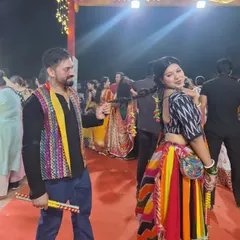 A playful moment during a Garba night in Delhi. The festive season is our favorite time of the year, filled with colorful ethnic wear, dandiya sticks, and non-stop dancing.
