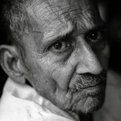 The thoughtful expression on this man's face tells a story of contemplation. I use black and white to strip away distractions and focus on the raw emotion, leaving a trace of our shared humanity.