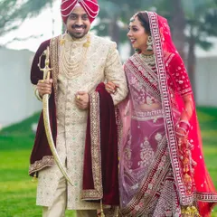 A candid moment of pure happiness between a beautiful Sikh couple. We believe the best shots are the unposed ones, capturing the genuine smiles and laughter that make your wedding day unique. This photo reflects our classic and vibrant wedding photography style.