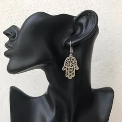 The Hamsa hand is a symbol of protection, and I've made it into this beautiful drop earring. It's a meaningful and stylish piece, available in both silver and antique gold tones.