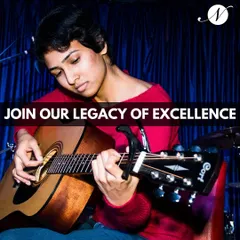 This image captures the focus and dedication of our guitar students. We offer a legacy of excellence with courses for all skill levels, from beginner to advanced, available both online and at our Bangalore locations.