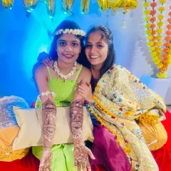 A bride posing with her friend during her mehndi ceremony. It's always fun to share these moments with your loved ones.