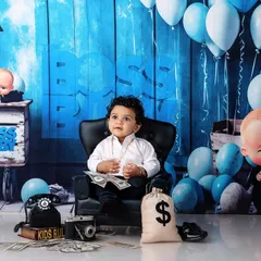Who's the boss? This little guy is, in our popular Boss Baby themed setup. Complete with a tiny suit, a bag of money, and a mini-throne, it's a fun and playful way to capture your baby's big personality.