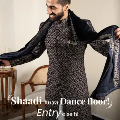 Shaadi ho ya dance floor, your entry should always make a statement. This navy blue patterned sherwani is crafted for grand moments, ensuring you are the center of attention. The rich fabric and sharp cut offer both royal style and complete comfort for celebrating.