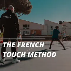 This is the French Touch Method in action. A coach observes a player's form during a drill, embodying our hands-on, high-intensity training approach.