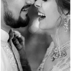 A close-up of pure, unadulterated laughter between a couple. This black and white shot captures the joy and chemistry that makes their bond so special.