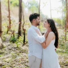 A walk in the woods becomes a romantic escape. I love using the soft, natural light filtering through the trees to create serene and intimate couple portraits.