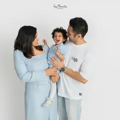 There is nothing more precious than a shared laugh. In my clean and simple studio space, your family's connection becomes the main focus, allowing for authentic moments like this to shine.