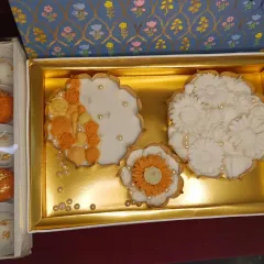This Urli Candle Box is a complete gift in itself. It contains a set of three intricately designed urli candles in varying sizes and floral patterns, presented in an elegant gift box.