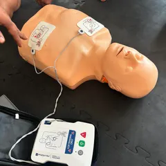 A close up of an AED (Automated External Defibrillator) used during our training. Our team is now trained in its proper use.