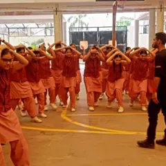 This is the result of our training: confidence. Here, I lead a large group of students at Gargi Girls School in a mindset drill. We build mental fortitude first, teaching them to occupy their space fearlessly and project strength, which is the first line of defense.