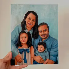 A hand-held view of the finished family portrait. I take care to capture the likeness and personality of each family member, from the parents down to the youngest child.