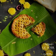 Here you can see the rich, flavorful filling of the Egg Roast Puff Pie. The combination of the flaky pastry and the spicy masala is something my clients love.