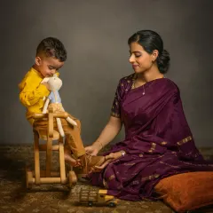 A storybook session can also be a beautiful setting for a mother-child portrait. Here, a mother and her toddler share a quiet moment, a scene that tells a story of love and the challenges of modern motherhood.
