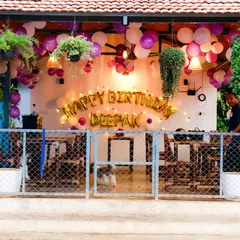 A wider view of the restaurant setup, showing how our decorations can transform a section of a public space into a private celebration area.
