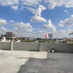 Another view of a plain terrace before my work begins. You can see the open space and city view, which provides a great canvas for a green transformation.