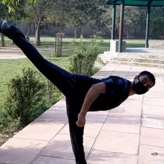 This is a demonstration of a back horse kick, a dynamic kick that targets opponents behind you. It requires excellent balance, core strength, and awareness of your surroundings.