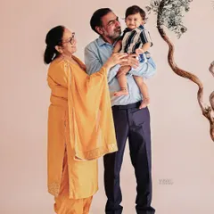 Because birthdays are a family celebration, we always encourage everyone to join in. Capturing this beautiful moment with grandparents creates a timeless family portrait that will be cherished for generations.