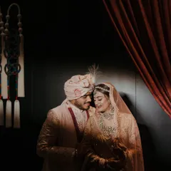 A quiet, intimate portrait of the bride and groom. Amidst the grand celebrations, we ensure there are spaces and moments for the couple to connect, captured beautifully by their photography team.