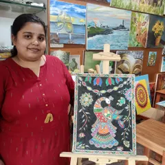 Here is my student, Sowmya, with her completed Madhubani painting of a peacock. Her work beautifully captures the detailed patterns and vibrant colors that define this traditional art form.