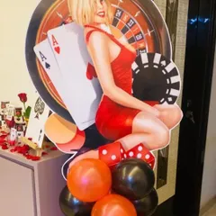A standee for a casino-themed party. These kinds of props and cutouts are great for adding to the theme and make for fun photo opportunities for guests.