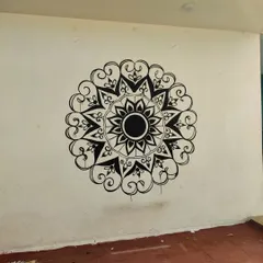 The completed black and white mandala, before the final color accents were added. Even in monochrome, the detailed patterns create a powerful visual impact, bringing a sense of focus and artistry to the space.