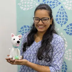 Here I am, holding the custom crochet dog 'Toby' that I made for a happy client.